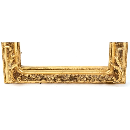 2184 - A modern 18th century style gilt painted pier mirror with leaf and ribbon surmount within a fruit an... 