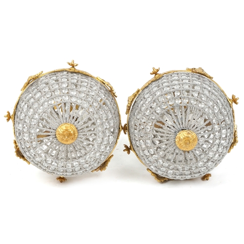 2170 - A pair of gilt metal and cut glass ceiling lights, 68cm high.