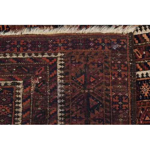 2211 - A Baluch prayer rug, 20th century, the brown field with an asymmetrical central panel within a flowe... 
