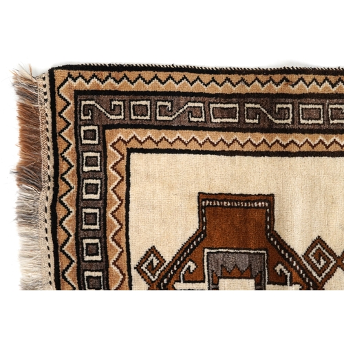 2203 - A Persian runner, the ivory field with four central medallions within a grey border, 212cm x 102cm.