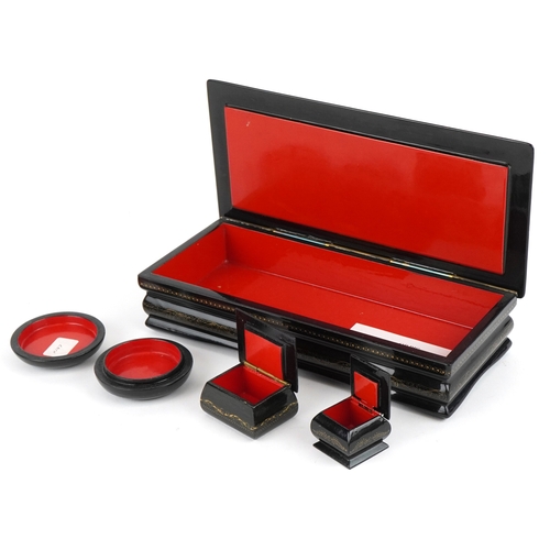 1570 - Four Russian lacquered papier mâché boxes, each hand painted with traditional folk art, the largest ... 