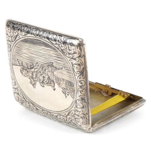 3595 - A 19th century Russian silver niello work cigarette case decorated with a three horse drawn troika, ... 