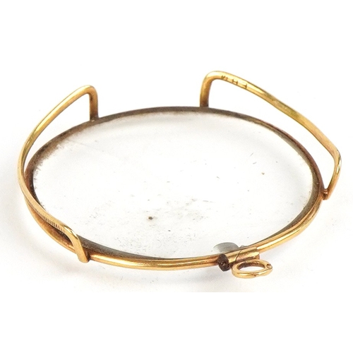 300 - An antique French 18K gold monocle, 4.5cm high, 7.3g.