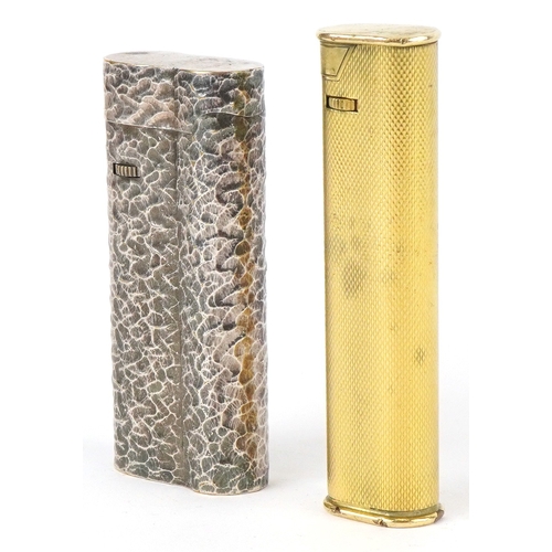 1560 - Two Dunhill pocket lighters, one with planished decoration, the largest 7.3cm high.