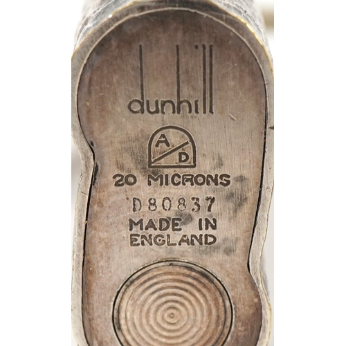 1560 - Two Dunhill pocket lighters, one with planished decoration, the largest 7.3cm high.