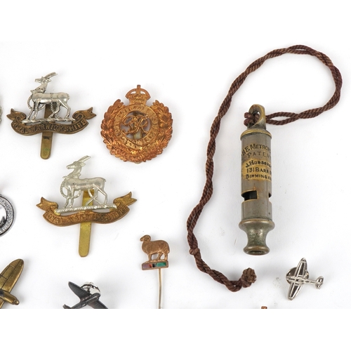 2826 - British militaria including a Christmas 1914 Mary tin, cap badges and a Metropolitan Police whistle.