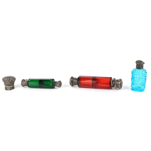 306 - Three Victorian glass scent bottles including two double ended examples, the largest 12cm in length.