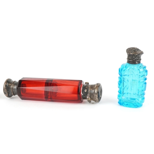 306 - Three Victorian glass scent bottles including two double ended examples, the largest 12cm in length.
