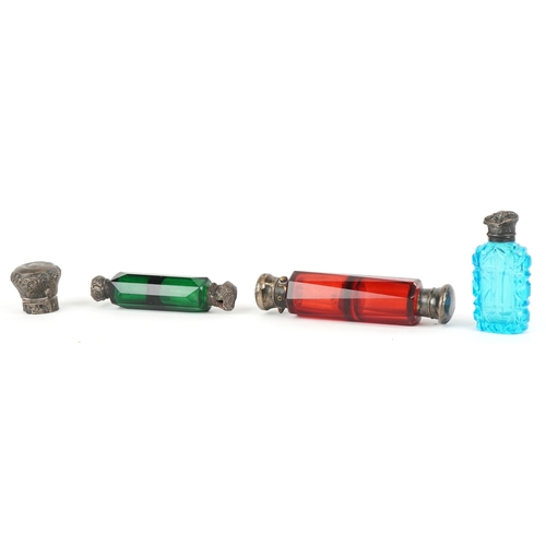 306 - Three Victorian glass scent bottles including two double ended examples, the largest 12cm in length.