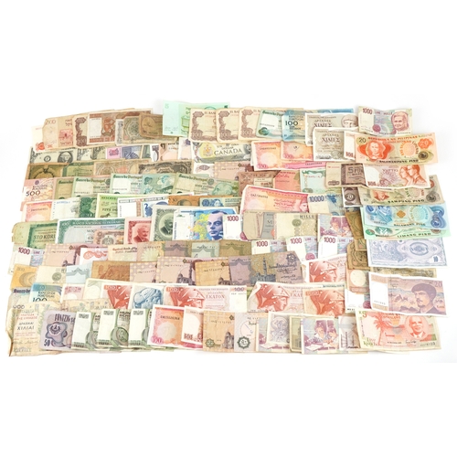 1216 - A large quantity of vintage world banknotes including Italy, Belgium, Austria, Germany, Greece, Bulg... 