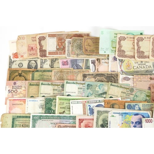 1216 - A large quantity of vintage world banknotes including Italy, Belgium, Austria, Germany, Greece, Bulg... 