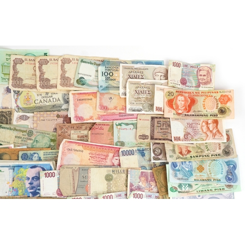 1216 - A large quantity of vintage world banknotes including Italy, Belgium, Austria, Germany, Greece, Bulg... 
