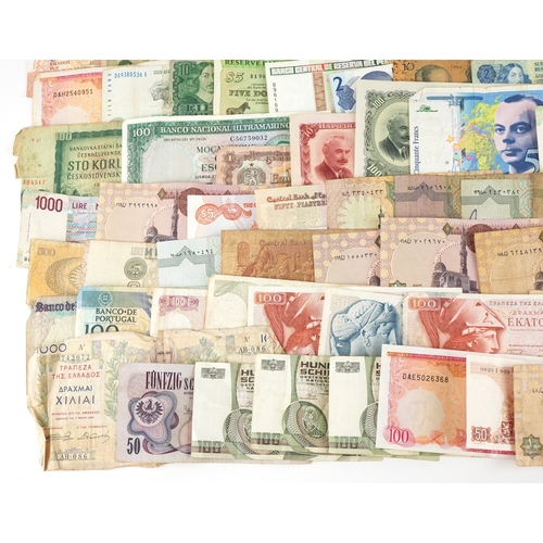 1216 - A large quantity of vintage world banknotes including Italy, Belgium, Austria, Germany, Greece, Bulg... 