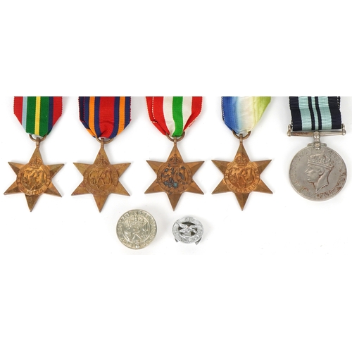 2694 - Five British military World War II medals and two cap badges including the Italy Star, the Pacific S... 