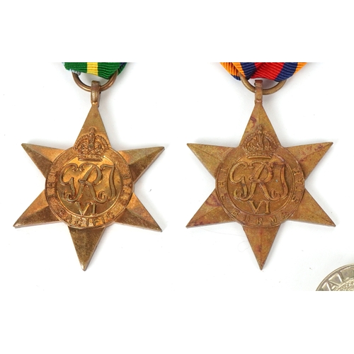 2694 - Five British military World War II medals and two cap badges including the Italy Star, the Pacific S... 