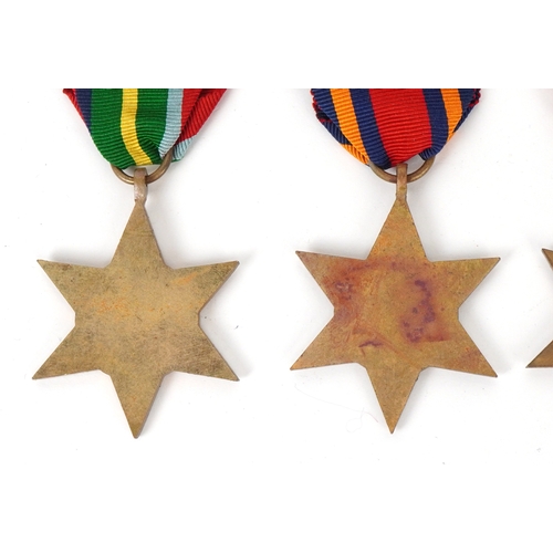 2694 - Five British military World War II medals and two cap badges including the Italy Star, the Pacific S... 