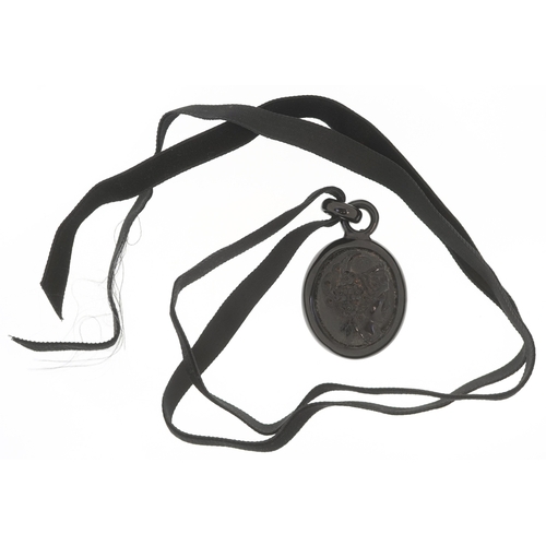 3330 - A Victorian cameo jet pendant carved in high relief with a maiden head, 5cm high, 14.5g.