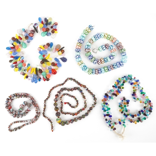 3333 - A collection of 20th century bead necklaces including Czech glass Mali wedding beads, the largest 78... 
