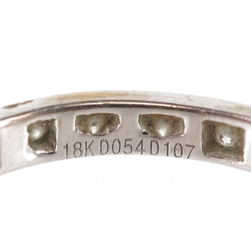 3211 - An 18K white gold diamond eternity ring, size Q, 1.8g.