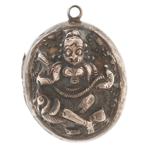 3381 - An Indian unmarked silver locket decorated in repoussé with a deity, 3cm high, 13.9g.