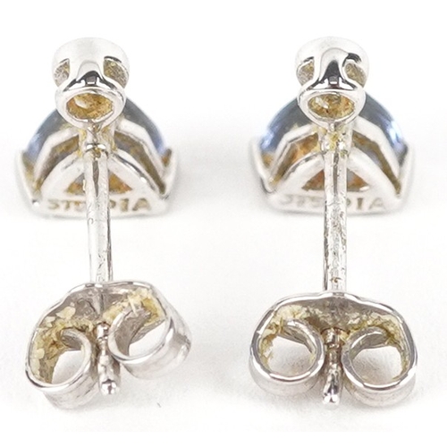 3105 - A pair of 9ct white gold diamond and blue stone stud earrings, 7.9mm high, total 1.0g.