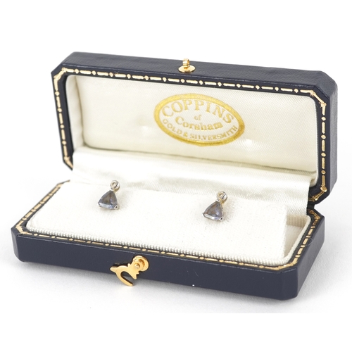 3105 - A pair of 9ct white gold diamond and blue stone stud earrings, 7.9mm high, total 1.0g.
