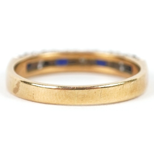 3201 - An 18ct gold diamond and blue spinel half eternity ring, size K, 2.8g.