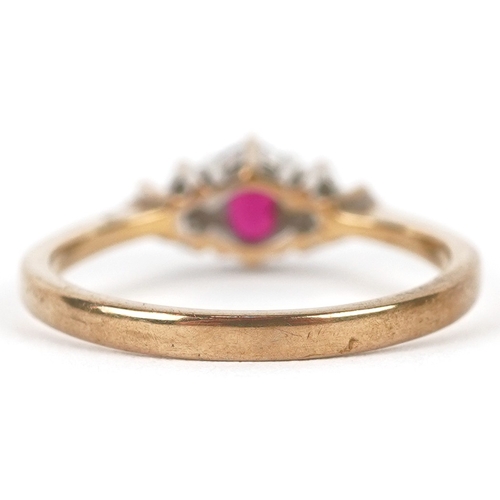 3220 - A 9ct gold ruby solitaire ring with diamond set shoulders, size N, 2.2g.