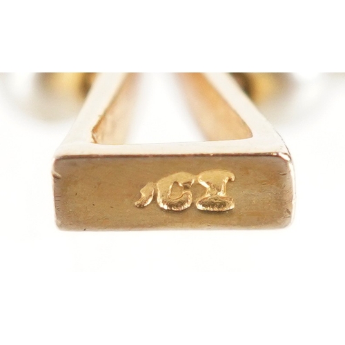 3235 - A 9ct gold simulated pearl Celtic cross pendant, 2.4cm high, 1.2g.