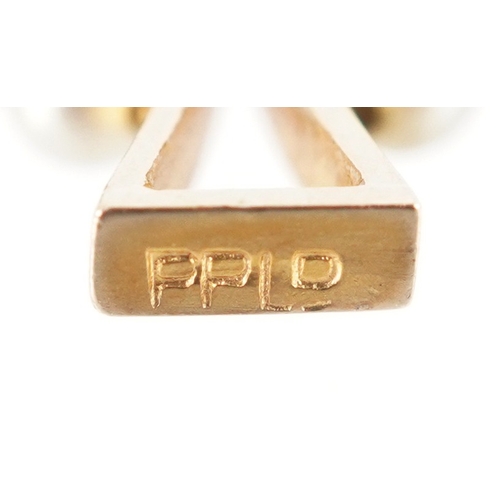 3235 - A 9ct gold simulated pearl Celtic cross pendant, 2.4cm high, 1.2g.