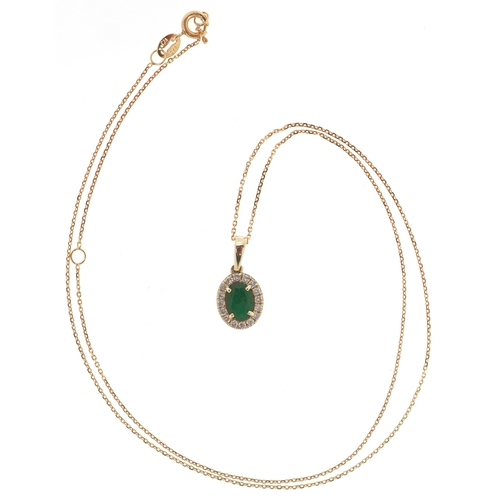 3206 - A 9K gold emerald and diamond cluster pendant on a 9K gold necklace, total diamond weight 0.19 carat... 
