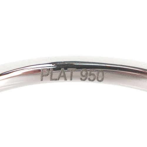 3177 - A platinum emerald and diamond trilogy ring, total diamond weight 0.22 carat, total emerald weight 0... 