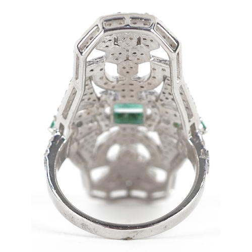 3377 - An Art Deco style silver emerald and diamond panel ring, total diamond weight 1.90 carat, total emer... 