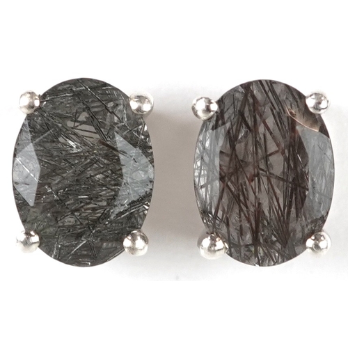 3197 - A pair of silver rutilated quartz stud earrings, 8.1mm high, total 1.7g.