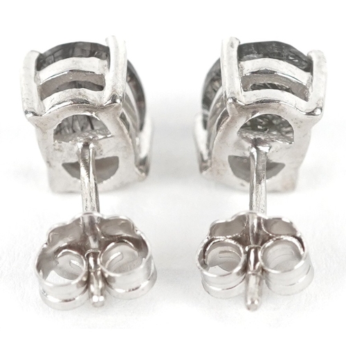 3197 - A pair of silver rutilated quartz stud earrings, 8.1mm high, total 1.7g.