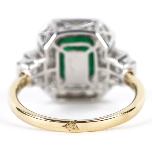 3043 - An Art Deco style 18ct yellow and white gold emerald and diamond cluster ring with diamond stepped s... 