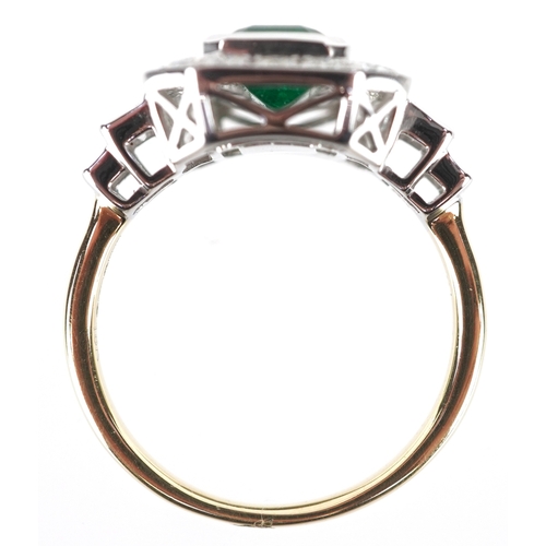 3043 - An Art Deco style 18ct yellow and white gold emerald and diamond cluster ring with diamond stepped s... 
