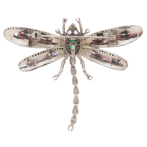 3064 - A silver diamond and emerald dragonfly brooch with tanzanite set eyes and guilloche enamelled wings,... 