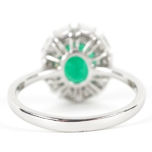 3107 - An 18ct white gold emerald and baguette cut diamond cluster ring, total diamond weight 0.41 carat, t... 