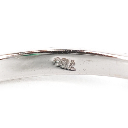 3107 - An 18ct white gold emerald and baguette cut diamond cluster ring, total diamond weight 0.41 carat, t... 