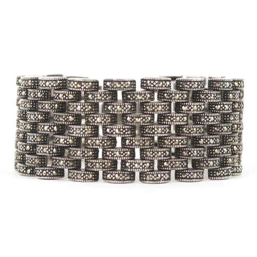 3132 - An Art Deco style silver marcasite nine row bracelet, 18cm in length, 75.3g.