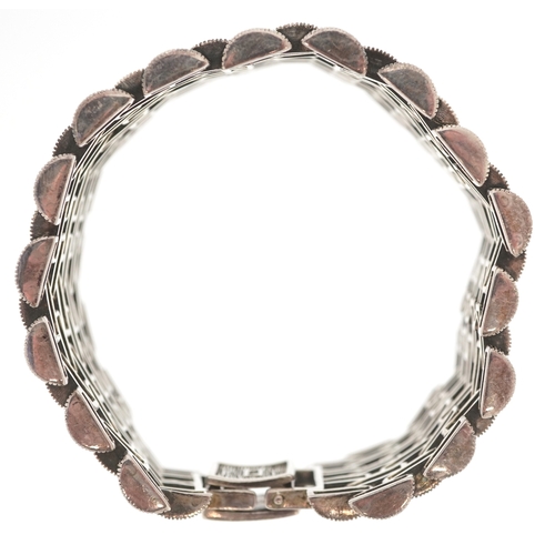 3132 - An Art Deco style silver marcasite nine row bracelet, 18cm in length, 75.3g.