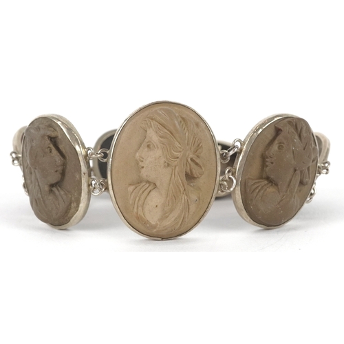 3146 - An antique white metal lava cameo bracelet carved with maiden heads, 16cm in length, 30.7g.