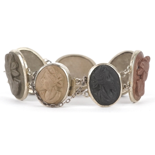 3146 - An antique white metal lava cameo bracelet carved with maiden heads, 16cm in length, 30.7g.