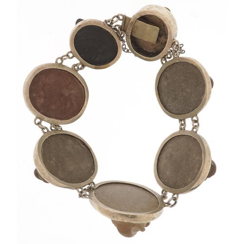 3146 - An antique white metal lava cameo bracelet carved with maiden heads, 16cm in length, 30.7g.