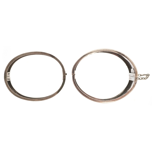 3163 - A Victorian silver bangle with engraved floral decoration, Birmingham 1876 together with a similar e... 