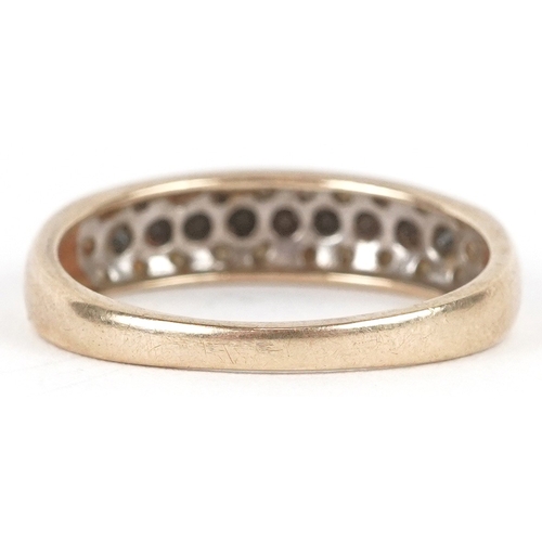 3195 - A 9ct gold black and white diamond three row half eternity ring, size P, 2.1g.