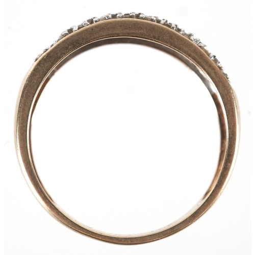 3195 - A 9ct gold black and white diamond three row half eternity ring, size P, 2.1g.