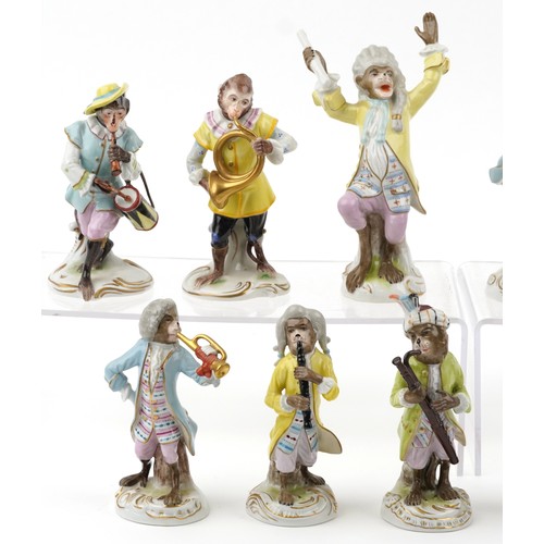 26 - A 20th century eleven piece German porcelain monkey band, after Meissen, comprising Älteste Volksted... 