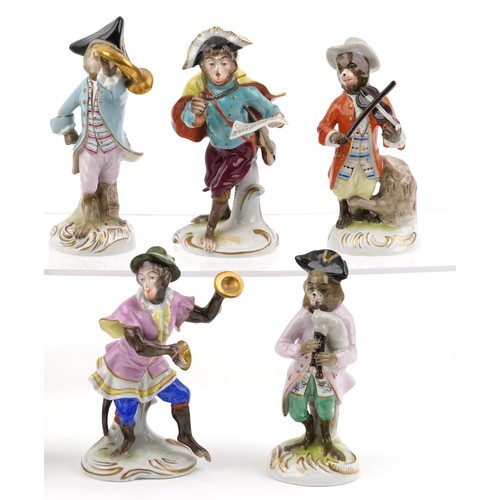 26 - A 20th century eleven piece German porcelain monkey band, after Meissen, comprising Älteste Volksted... 